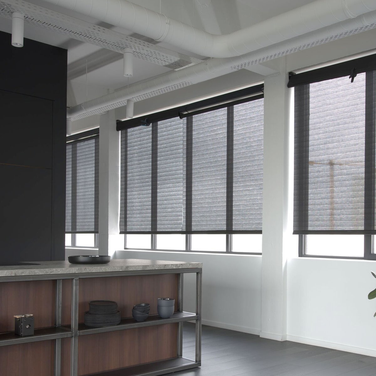 Dark roller shades in a modern kitchen